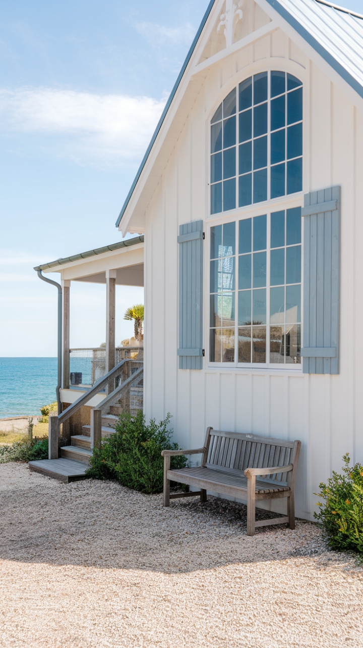 Seaside Modern Farmhouse with White Siding and Blue Accents